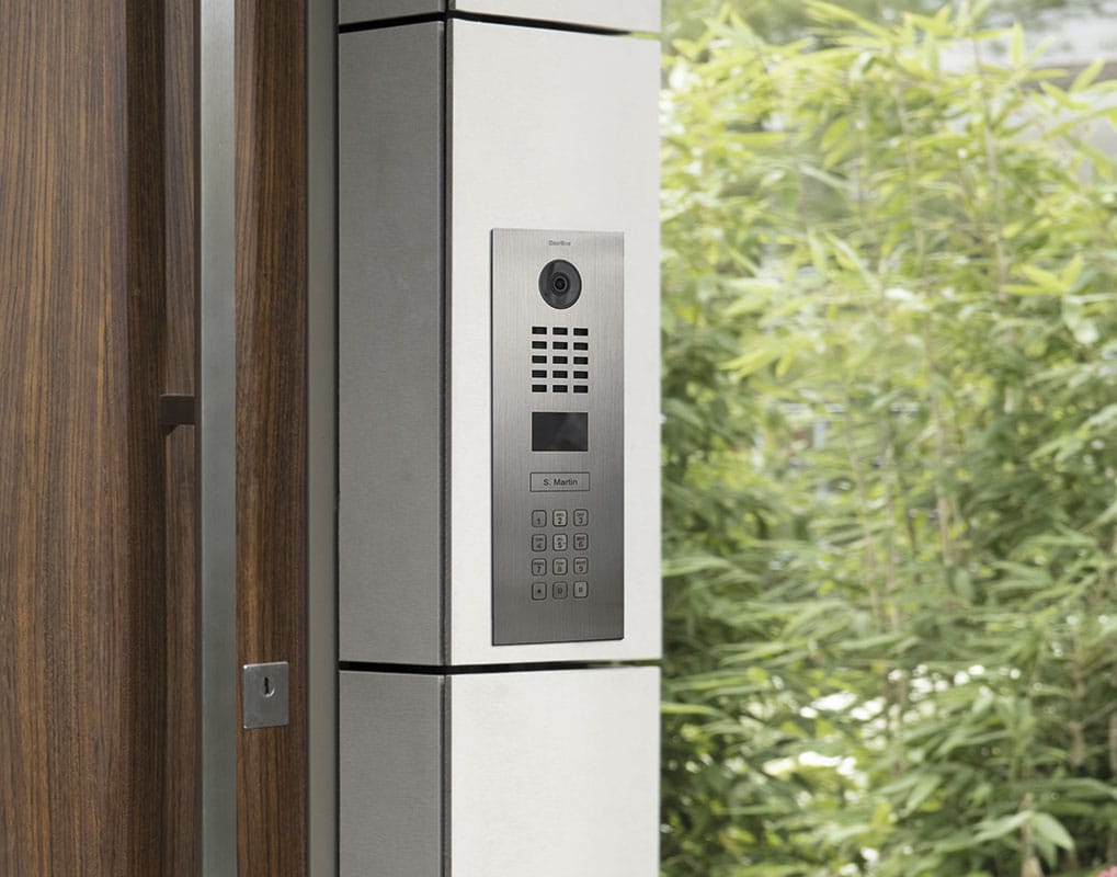 DoorBird D2101KV installed on a white entrance pillar