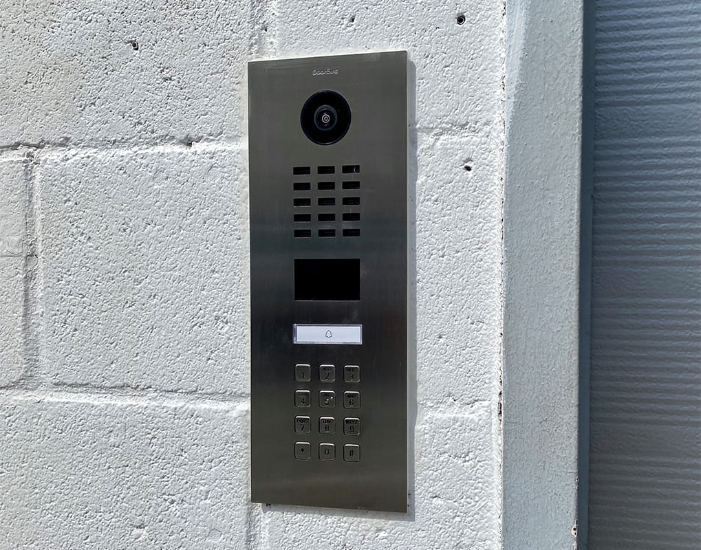 DoorBird D2101KV surface-mounted on a block wall