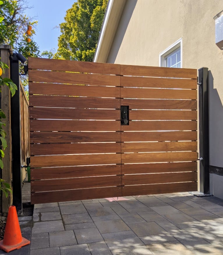 How Much Does a Driveway Gate Cost in 2026? Real Numbers by Material and Type — GateFrames driveway gate guide